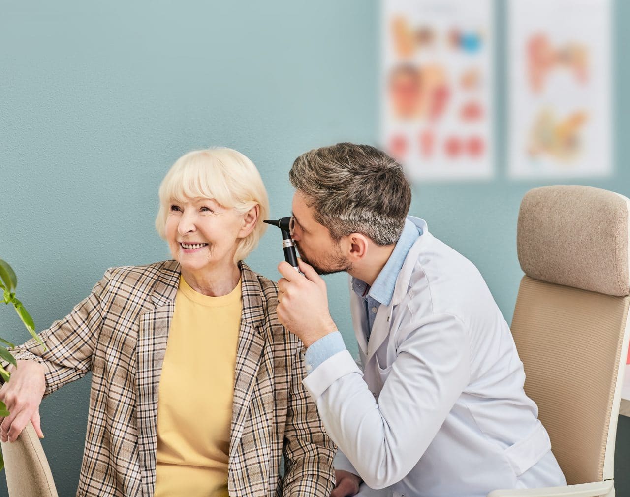 Woman getting her hearing checked by audiologist.