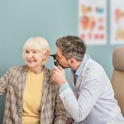 Woman getting her hearing checked by audiologist.