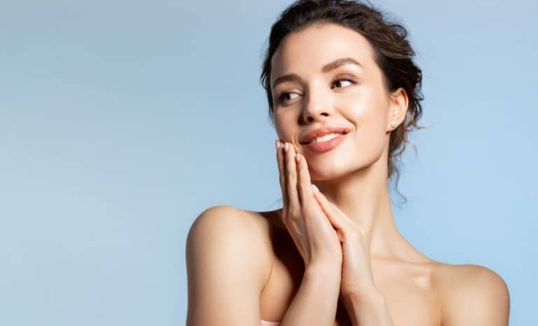 Facial Dermal Fillers a woman touches her face