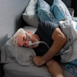 Man sleeping with a CPAP machine