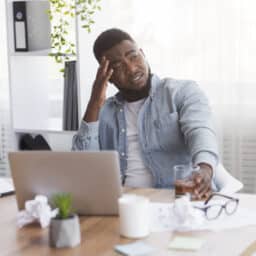 Tired man at his desk