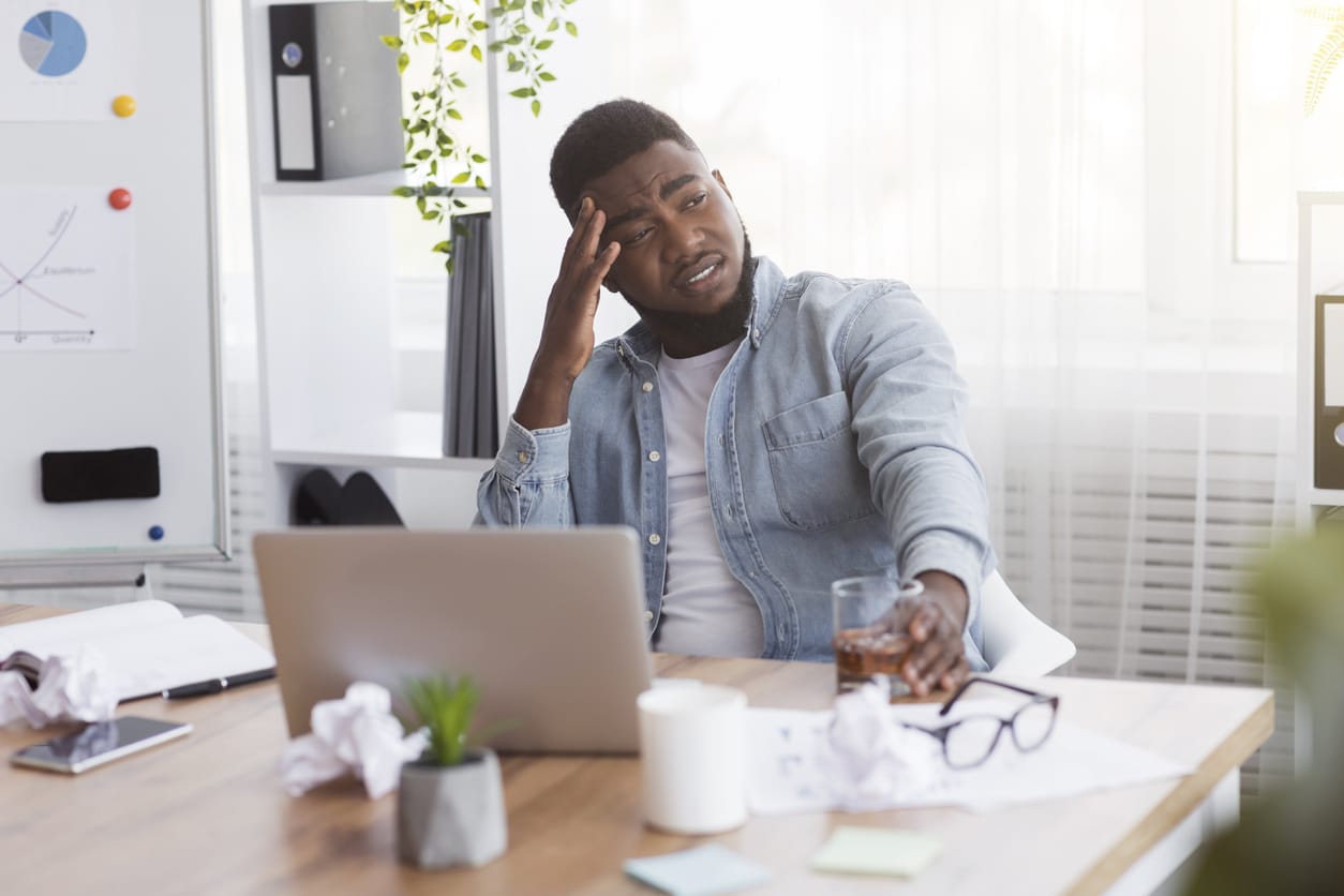 Tired man at his desk.